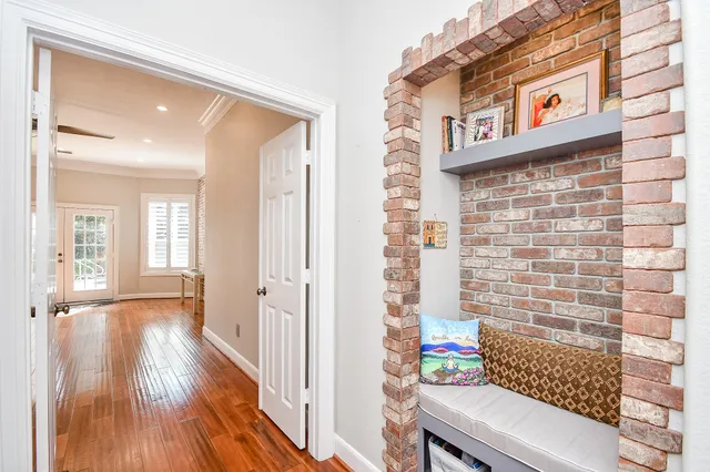 a bedroom with a bed and a book shelf