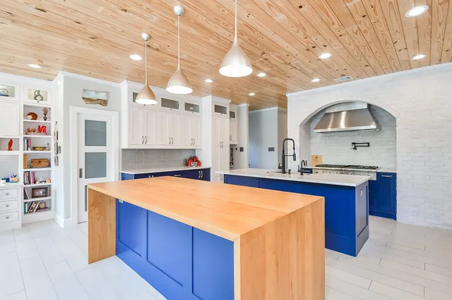 a kitchen with stainless steel appliances granite countertop a sink and cabinets