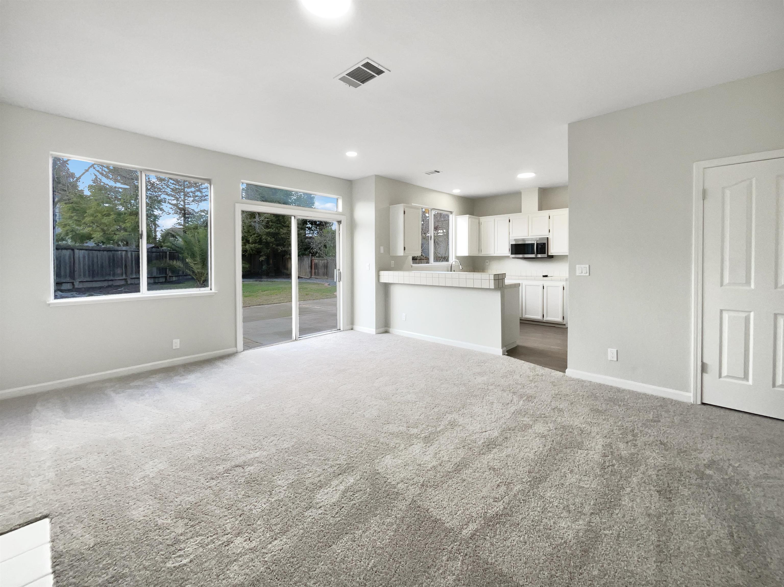1474 Rutherford Lane Oakley, CA 94561 - Photo 13 of 31 Unfurnished living room with dark carpet and recessed lighting