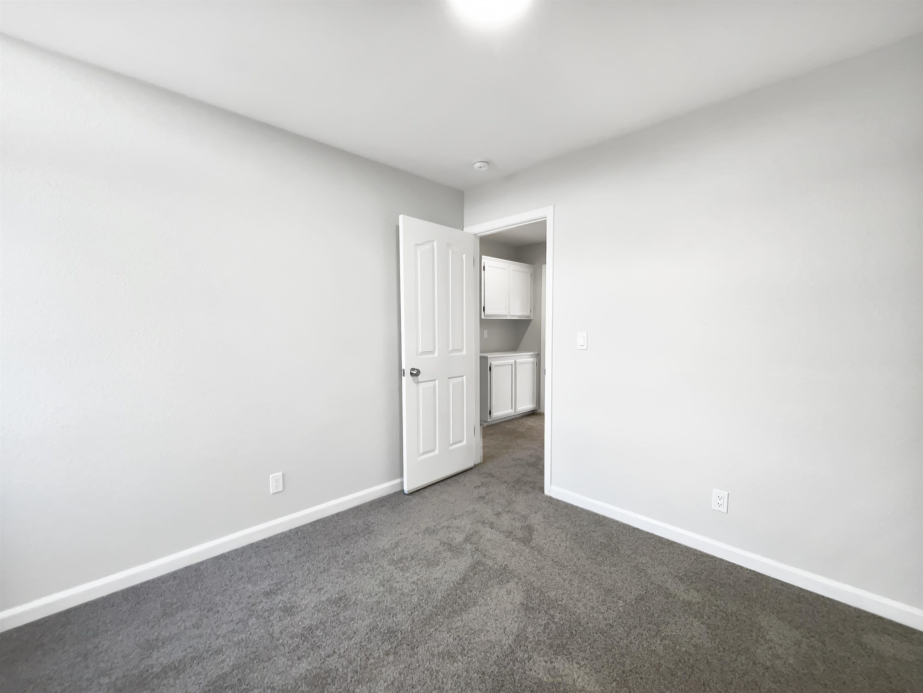 1474 Rutherford Lane Oakley, CA 94561 - Photo 19 of 31 Unfurnished bedroom with dark colored carpet and baseboards