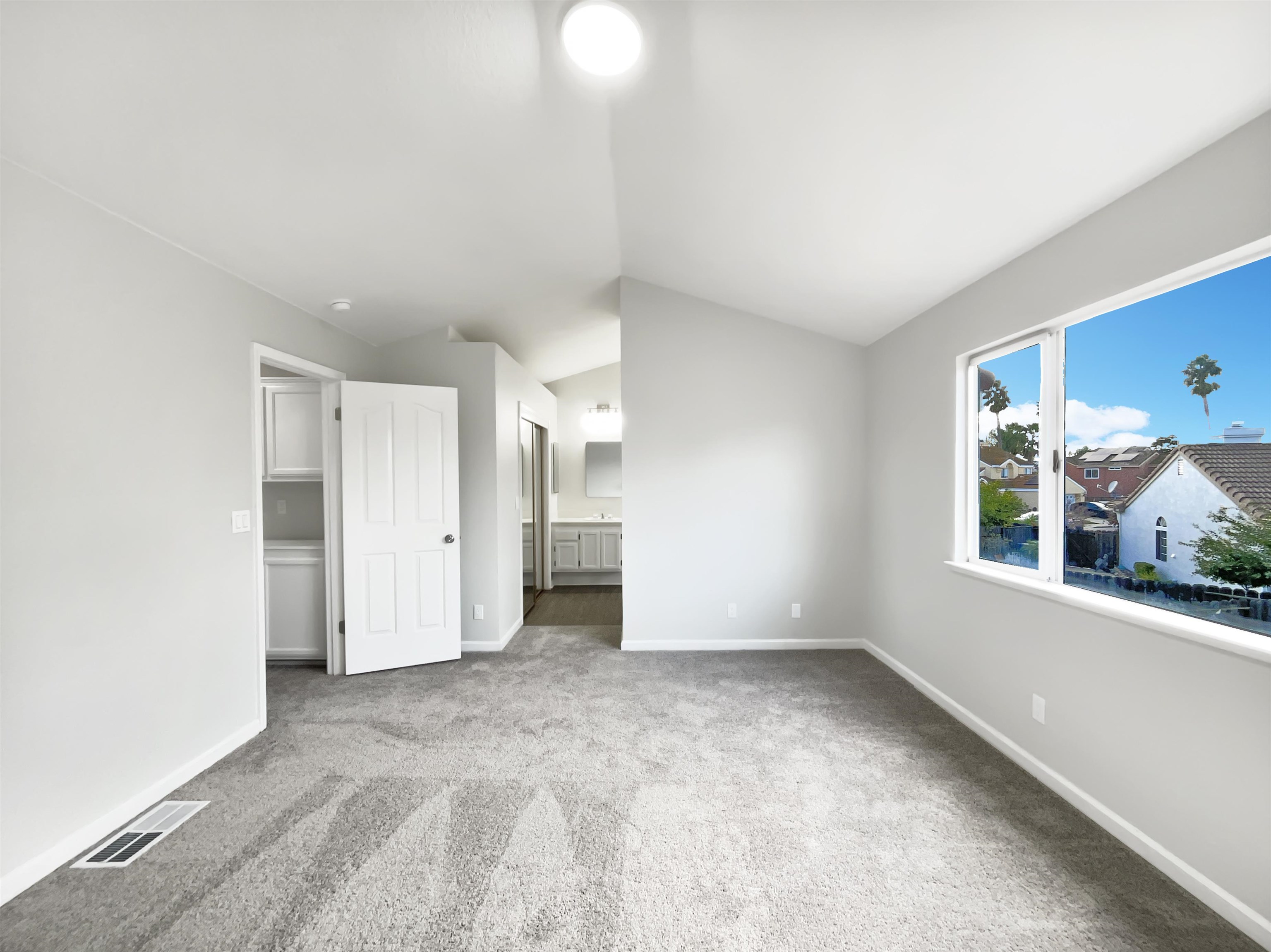 1474 Rutherford Lane Oakley, CA 94561 - Photo 23 of 31 Unfurnished bedroom with ensuite bath, light colored carpet, and lofted ceiling