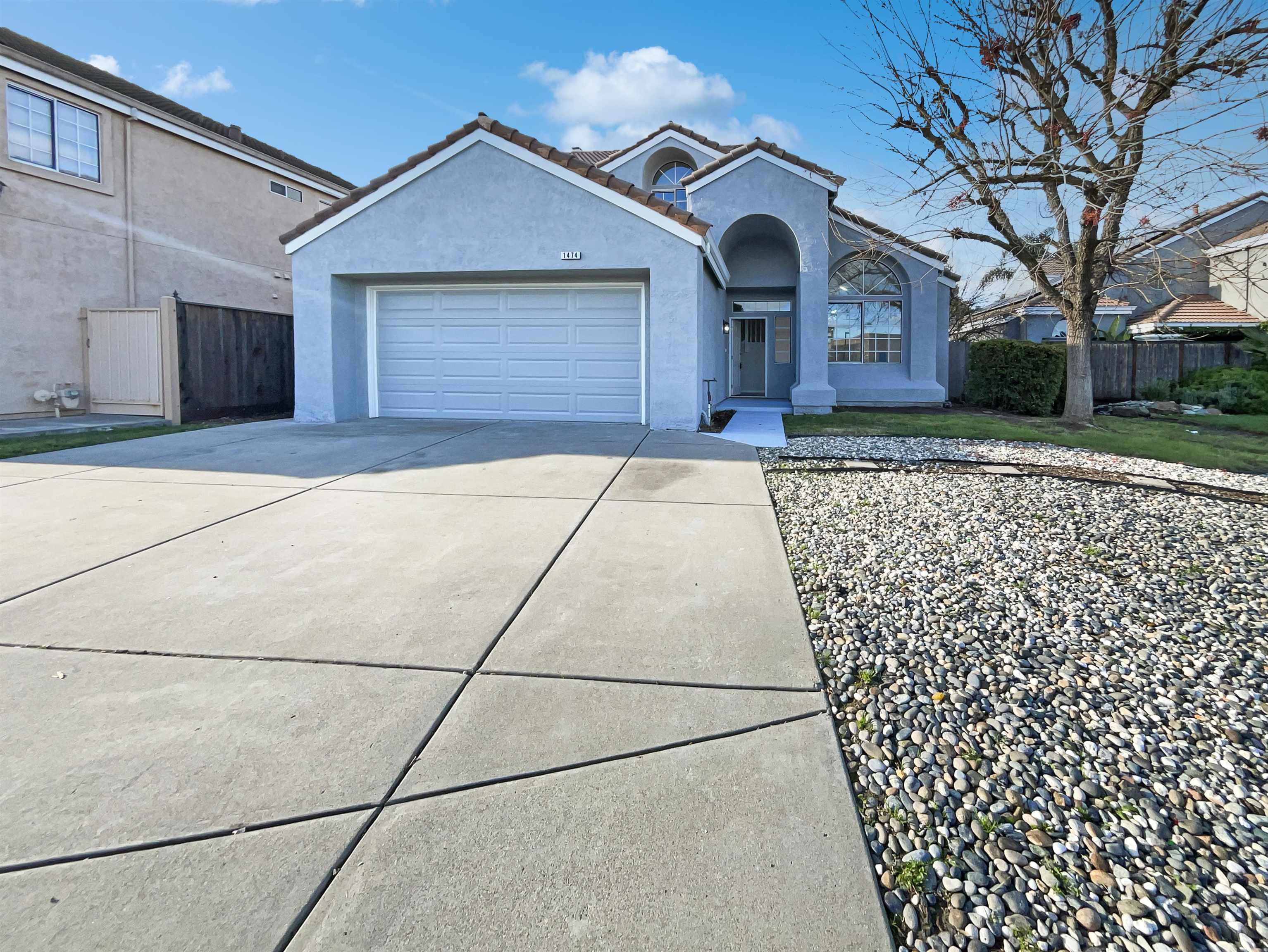 1474 Rutherford Lane Oakley, CA 94561 - Photo 25 of 31 Mediterranean / spanish house with a tiled roof, stucco siding, driveway, and a garage