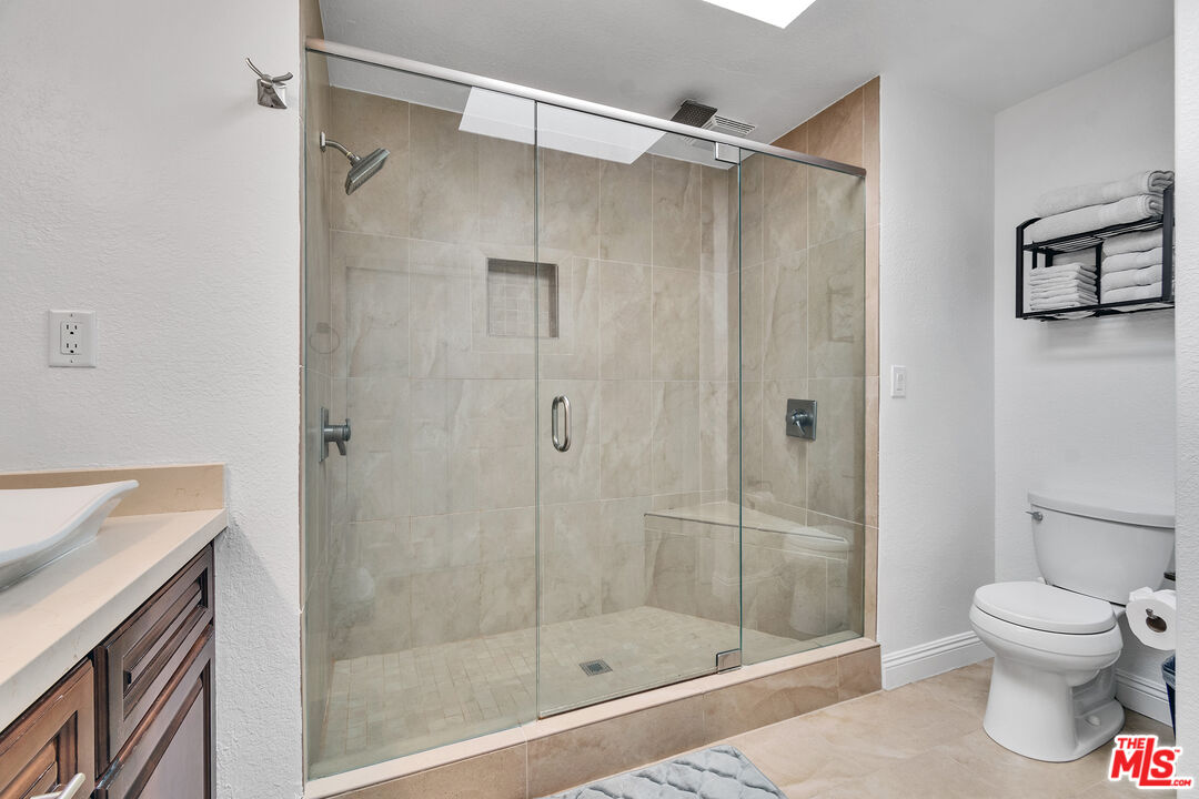 109 Torremolinos Drive Rancho Mirage, CA 92270 - Photo 11 of 39 a bathroom with a shower and a toilet