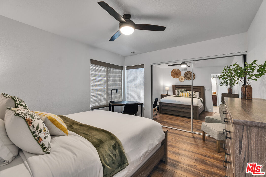 109 Torremolinos Drive Rancho Mirage, CA 92270 - Photo 12 of 39 a bedroom with a bed a dresser and potted plants