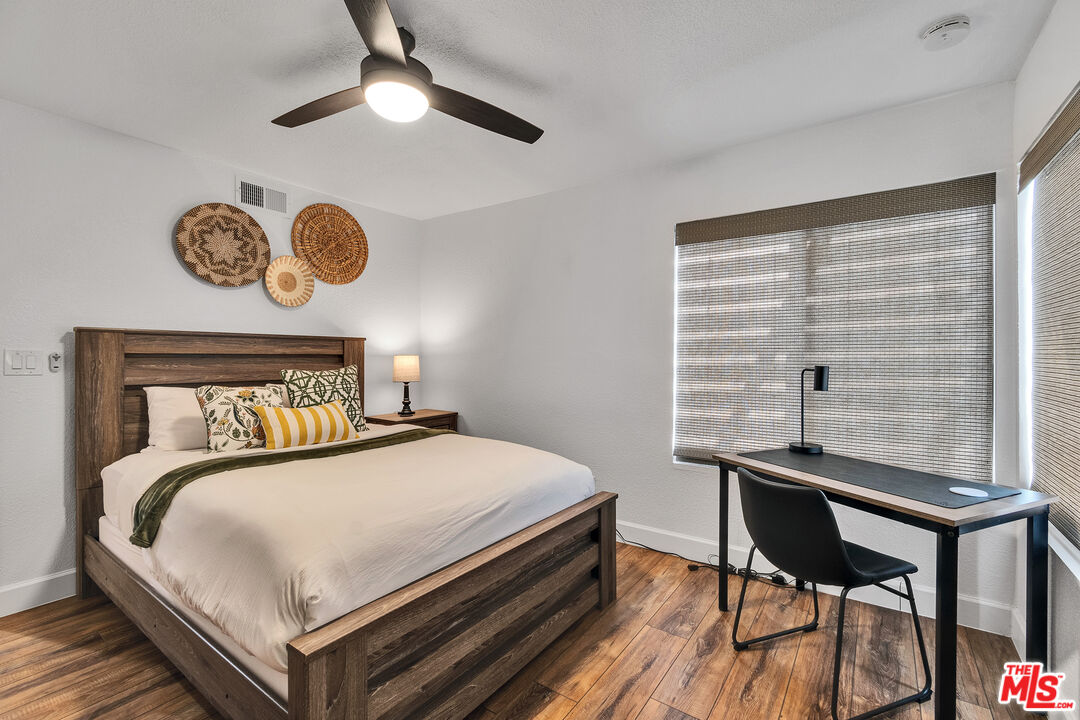 109 Torremolinos Drive Rancho Mirage, CA 92270 - Photo 13 of 39 a bedroom with a bed and a table