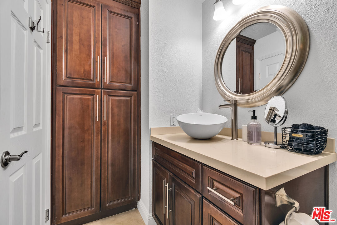 109 Torremolinos Drive Rancho Mirage, CA 92270 - Photo 14 of 39 a kitchen with stainless steel appliances granite countertop a sink and a refrigerator