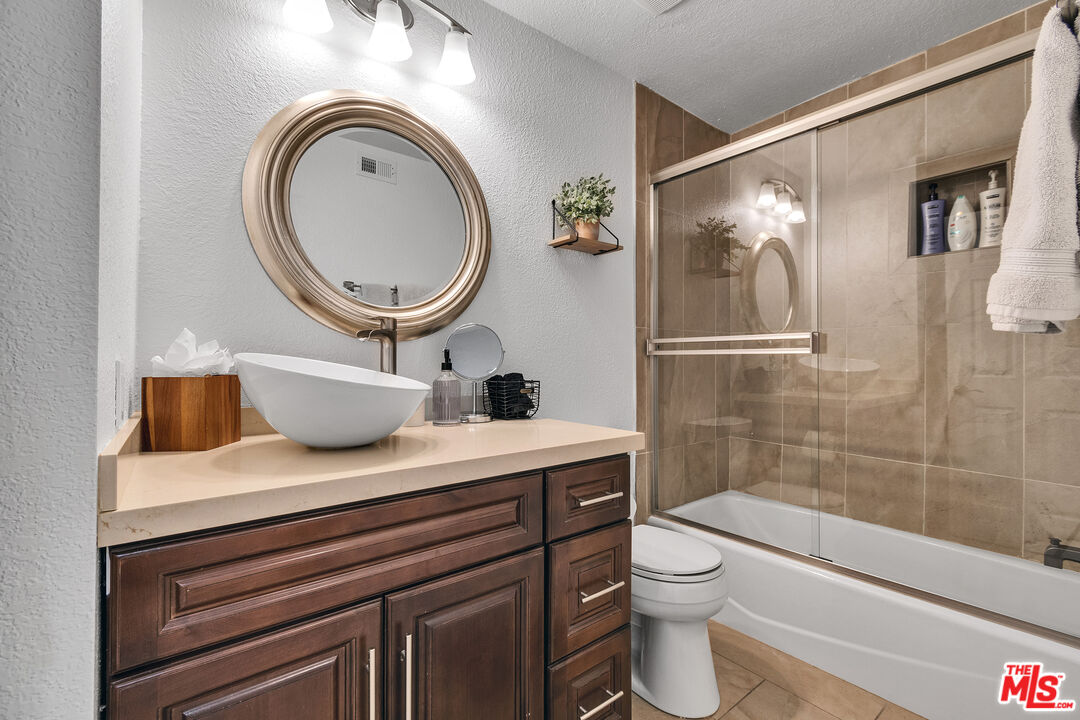109 Torremolinos Drive Rancho Mirage, CA 92270 - Photo 15 of 39 a bathroom with a sink a toilet and a shower