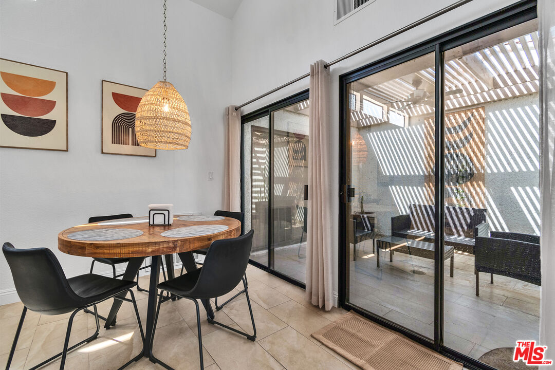 109 Torremolinos Drive Rancho Mirage, CA 92270 - Photo 18 of 39 a dining room with furniture and window