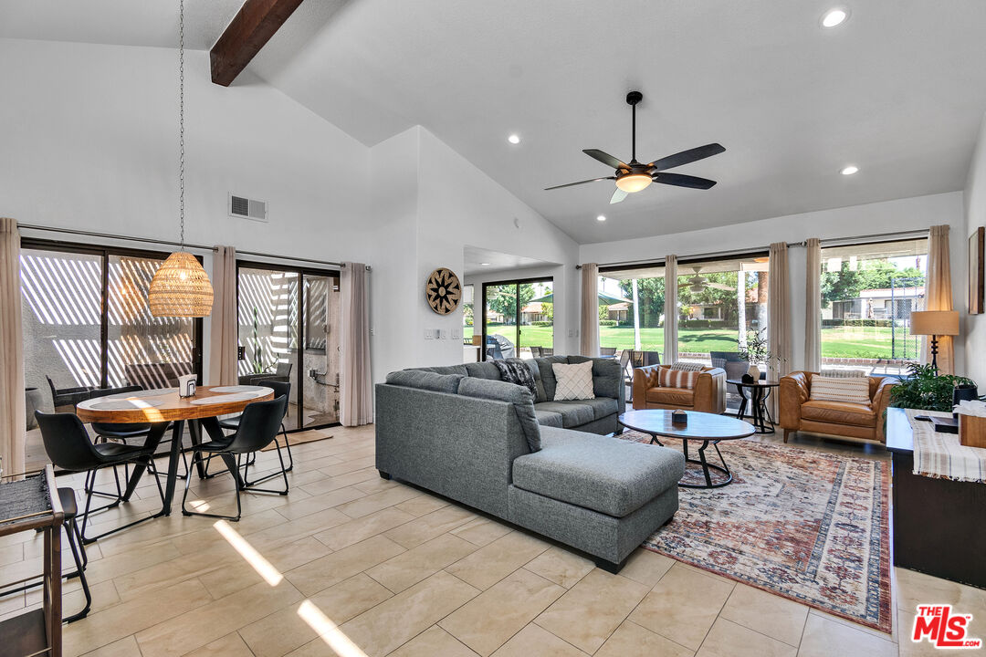 109 Torremolinos Drive Rancho Mirage, CA 92270 - Photo 20 of 39 a living room with furniture and a large window