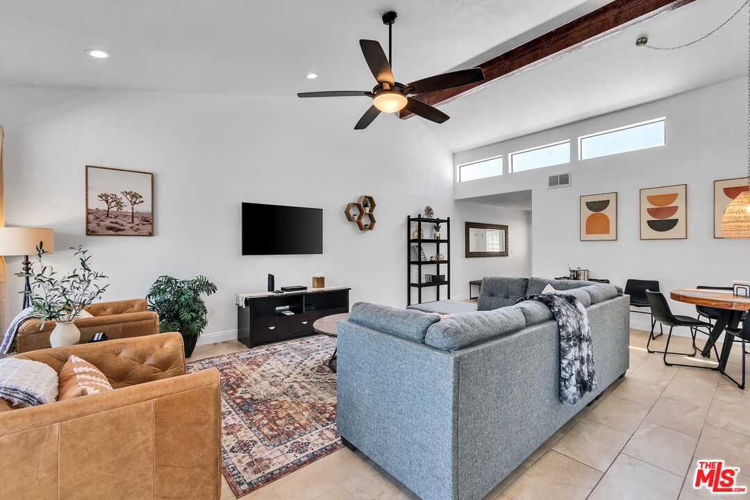109 Torremolinos Drive Rancho Mirage, CA 92270 - Photo 22 of 39 a living room with furniture and a flat screen tv