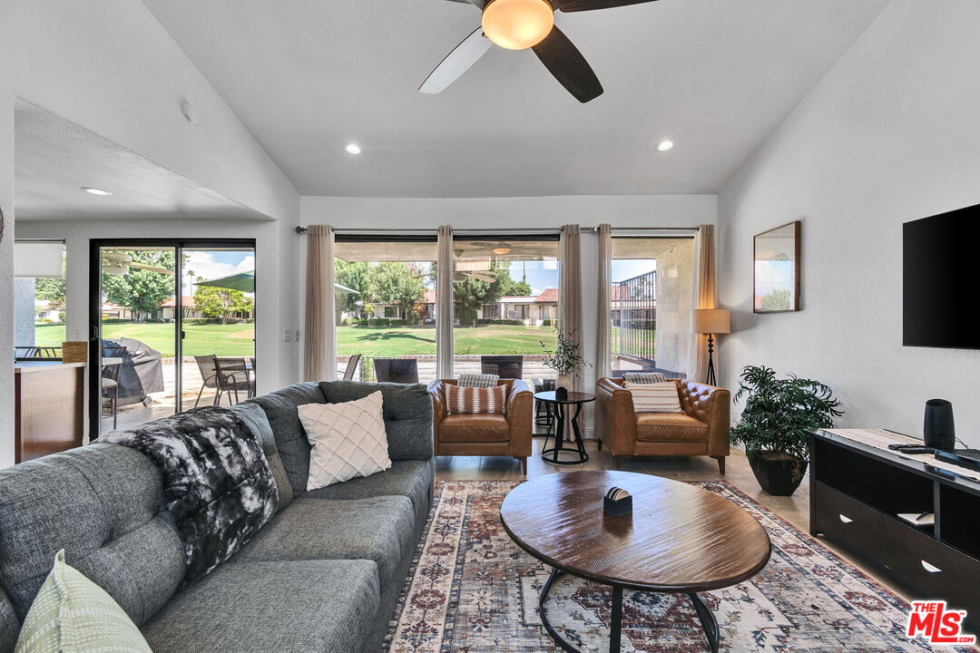109 Torremolinos Drive Rancho Mirage, CA 92270 - Photo 23 of 39 a living room with furniture and a large window