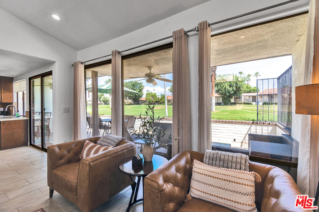 109 Torremolinos Drive Rancho Mirage, CA 92270 - Photo 24 of 39 a living room with furniture and a large window