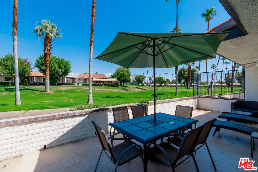 109 Torremolinos Drive Rancho Mirage, CA 92270 - Photo 31 of 39 a view of chairs and table in the yard