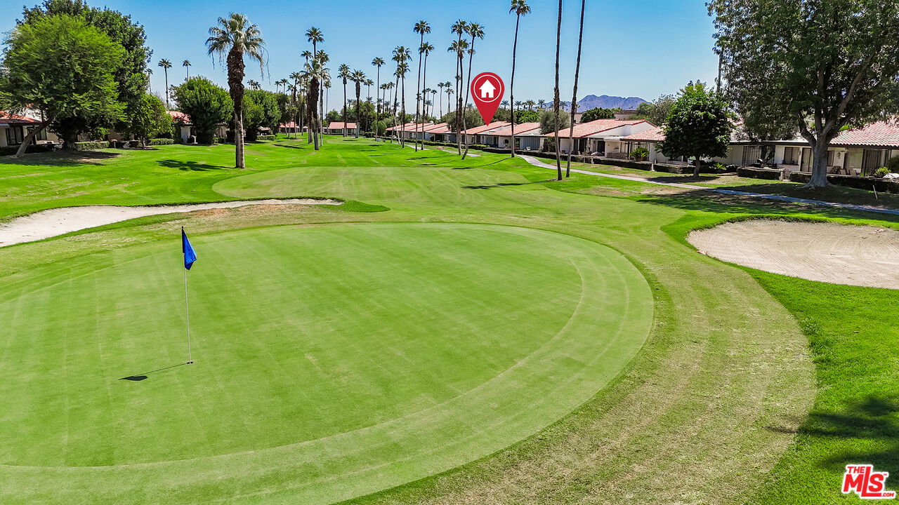 109 Torremolinos Drive Rancho Mirage, CA 92270 - Photo 35 of 39 a view of a golf course with a swimming pool
