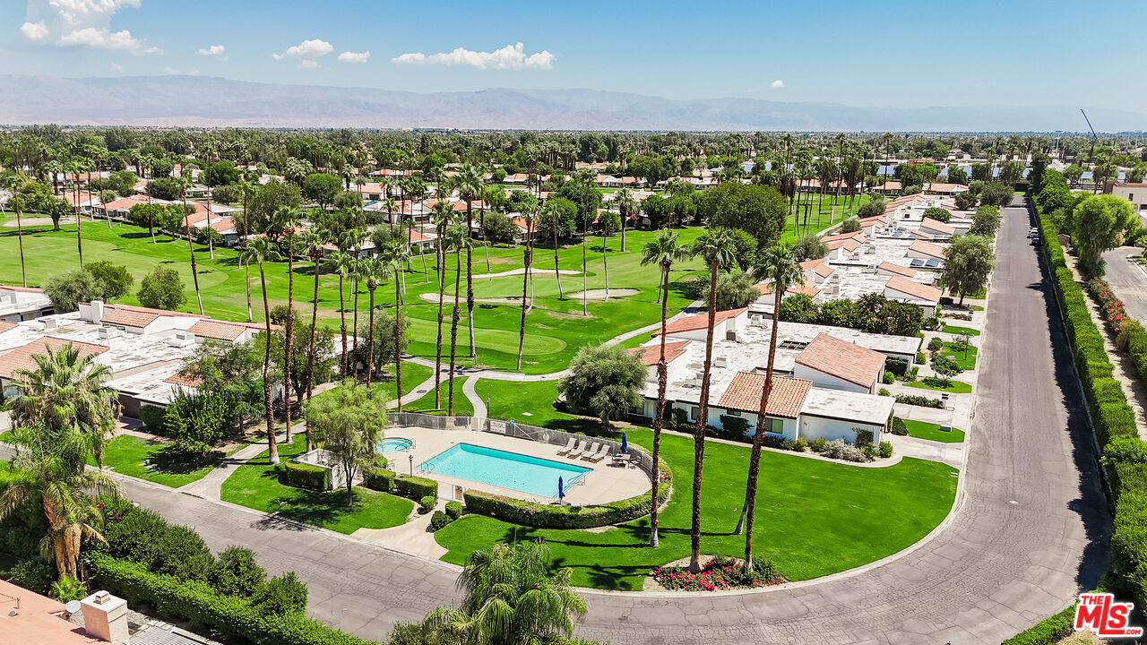 109 Torremolinos Drive Rancho Mirage, CA 92270 - Photo 39 of 39 an aerial view of a house with a garden and lake view