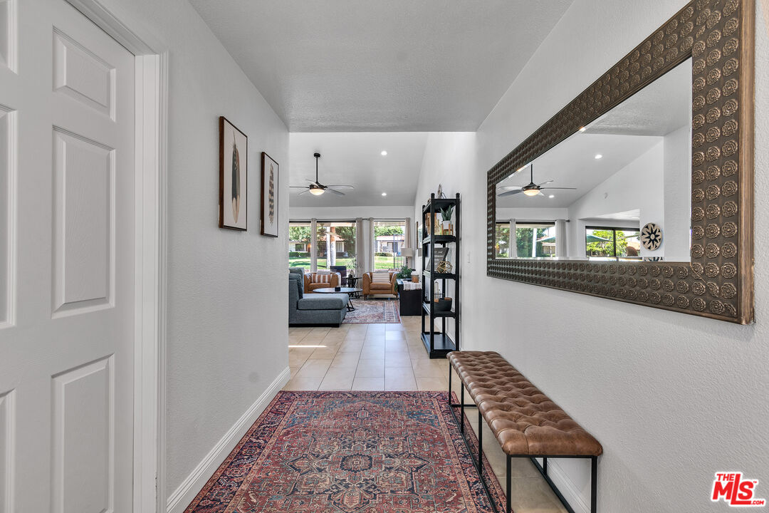 109 Torremolinos Drive Rancho Mirage, CA 92270 - Photo 6 of 39 a living room with furniture and a rug