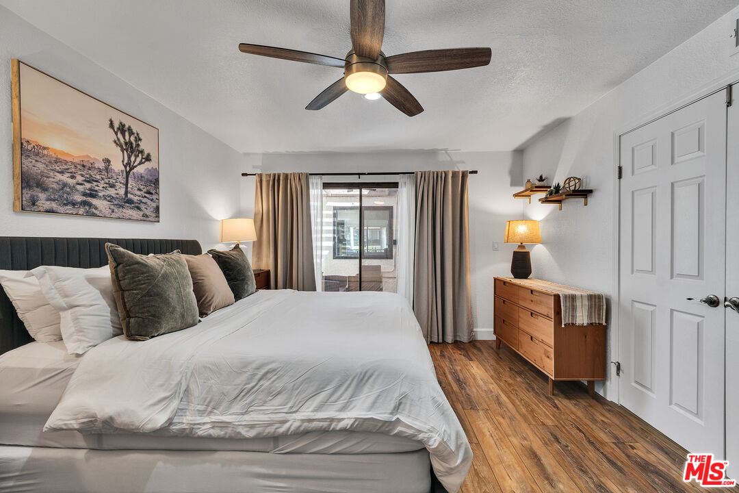 109 Torremolinos Drive Rancho Mirage, CA 92270 - Photo 7 of 39 a bedroom with a large bed and a chandelier