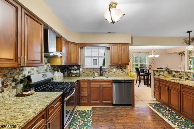 a kitchen with a stove and a sink