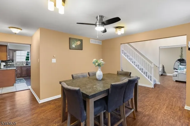 a view of a dining room with furniture and wooden floor