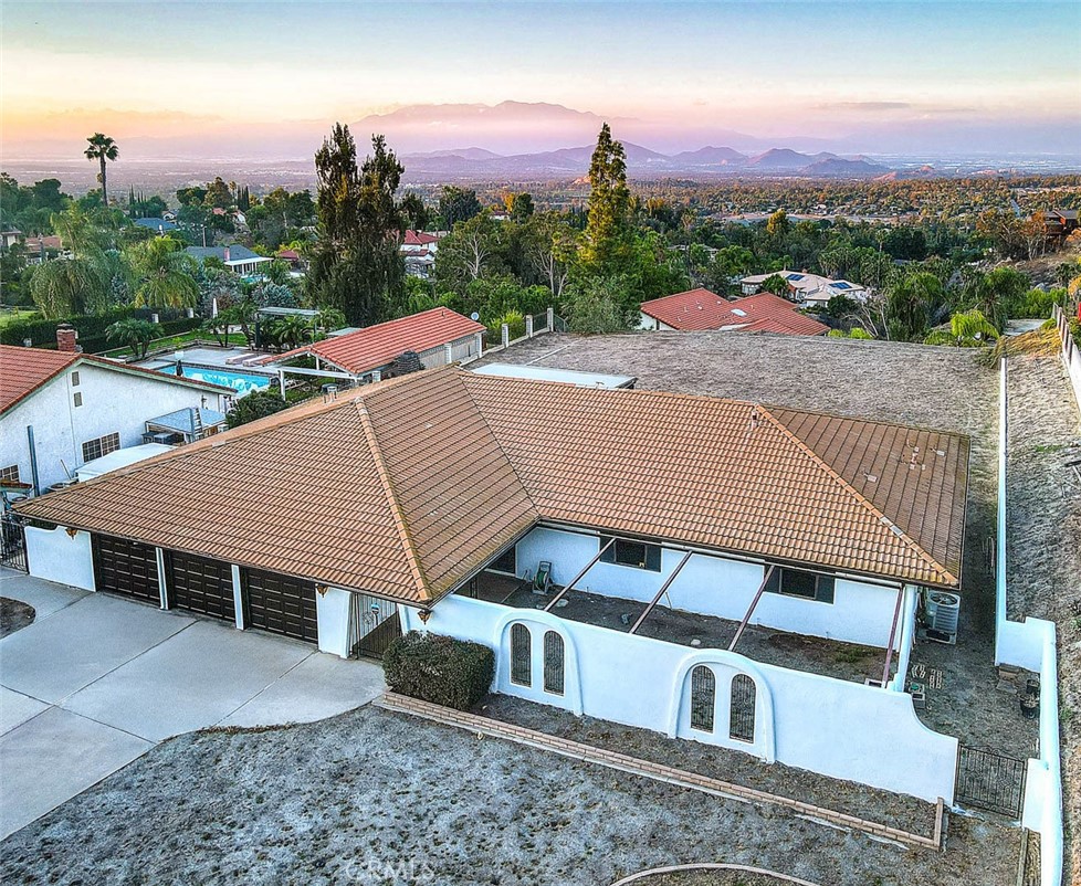 a aerial view of a house with a yard