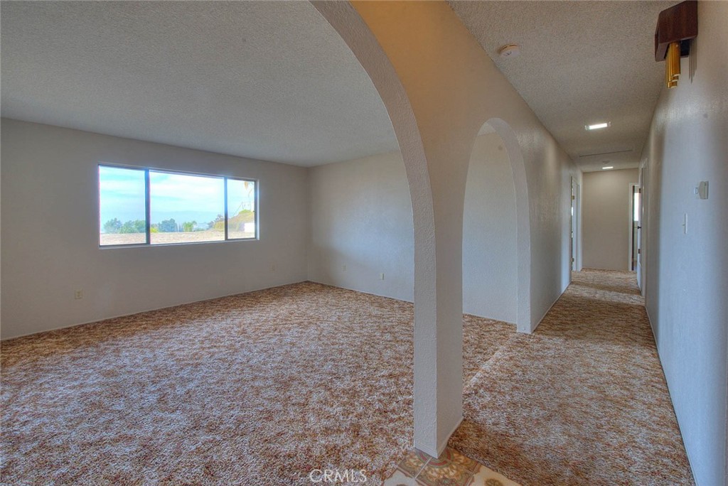 16464 Rancho Escondido Drive Riverside, CA 92506 - Photo 16 of 47 a view of an empty room and window