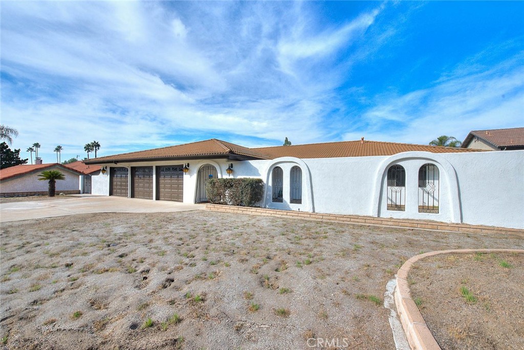 16464 Rancho Escondido Drive Riverside, CA 92506 - Photo 4 of 47 a view of house with yard and sitting area