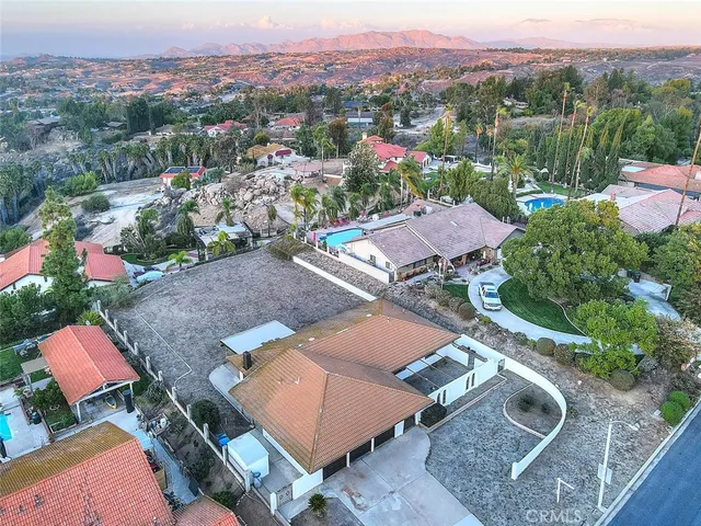 an aerial view of a house with a garden