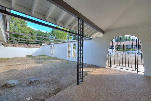 a view of an empty room with a balcony