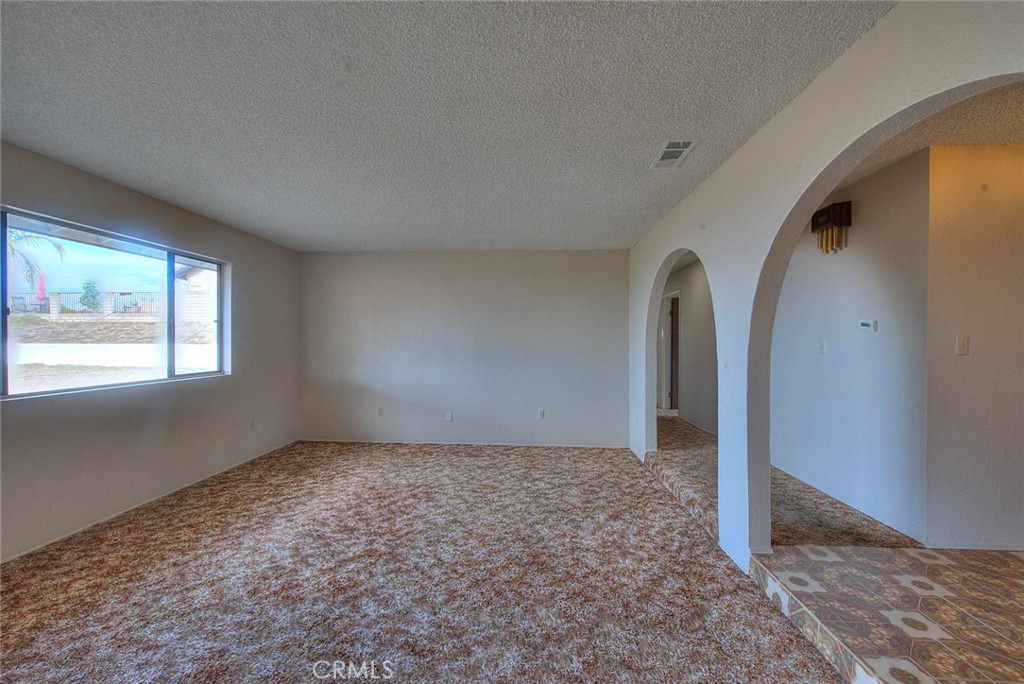 16464 Rancho Escondido Drive Riverside, CA 92506 - Photo 9 of 47 an empty room with windows