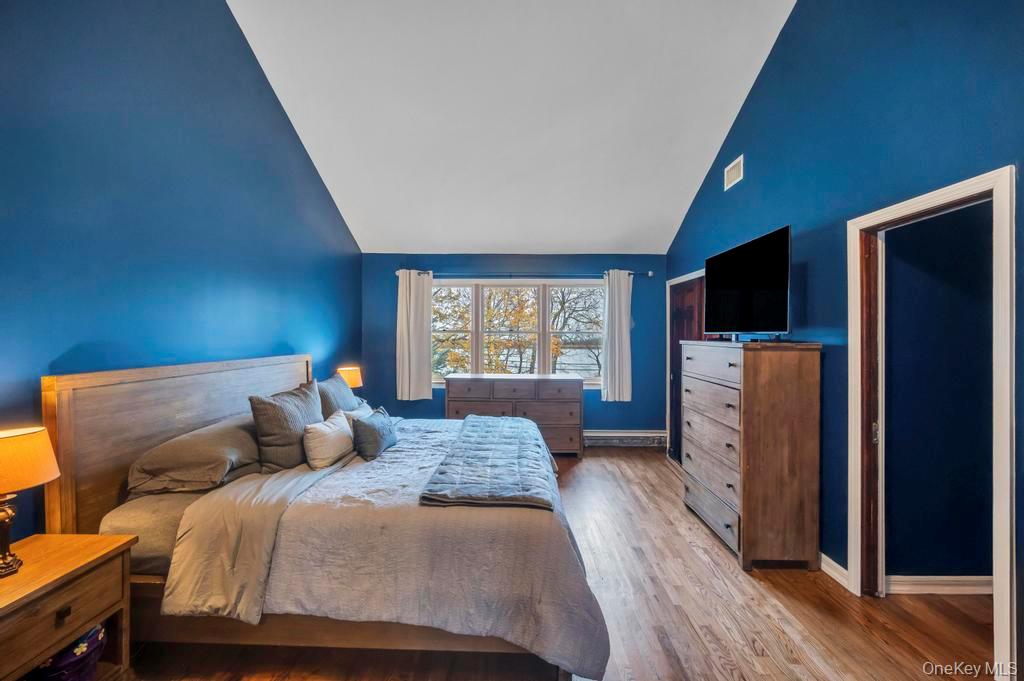 39 Bevin Road Northport, NY 11768 - Photo 31 of 44 Bedroom with wood finished floors and lofted ceiling