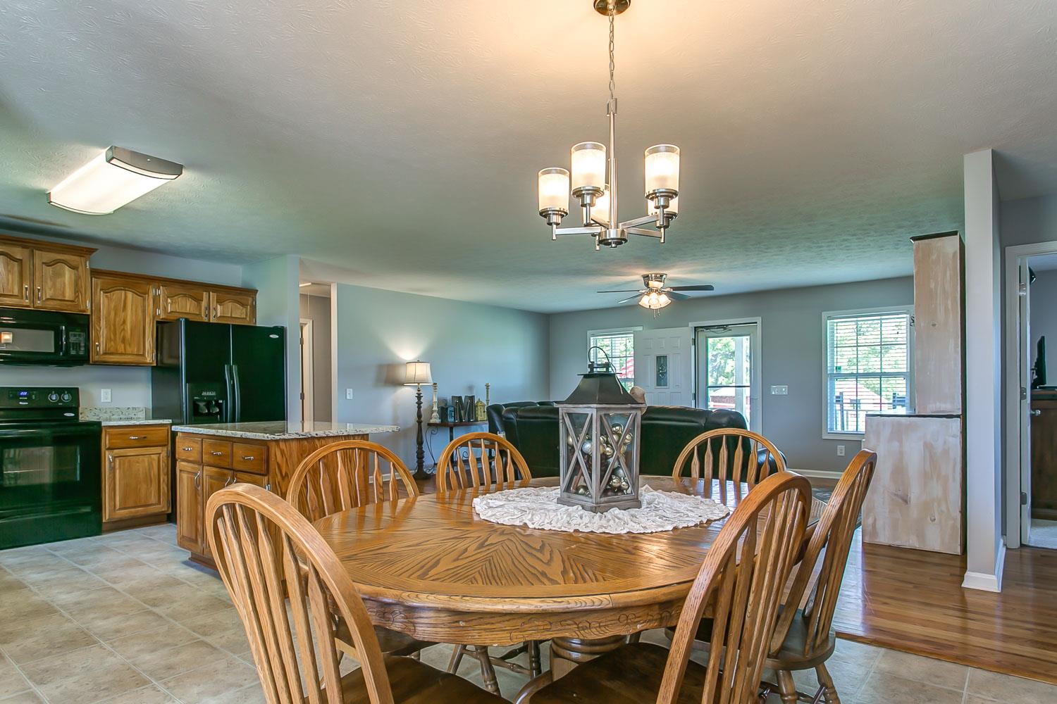 410 Jackson Road Portland, TN 37148 - Photo 8 of 22 a view of a dining room with furniture window and wooden floor
