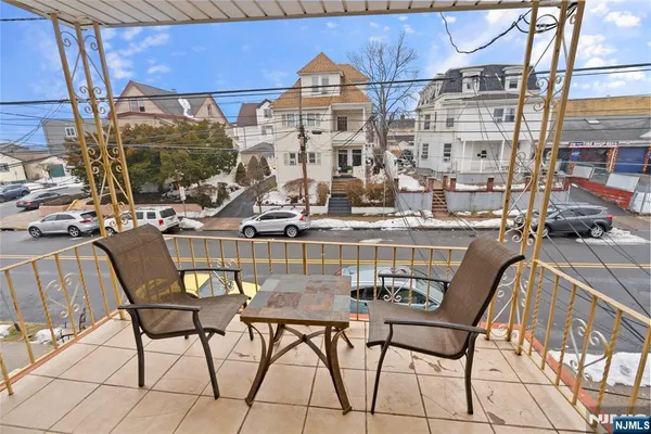 a view of a chairs and table in a patio