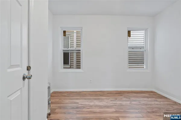 a view of a hallway with a window