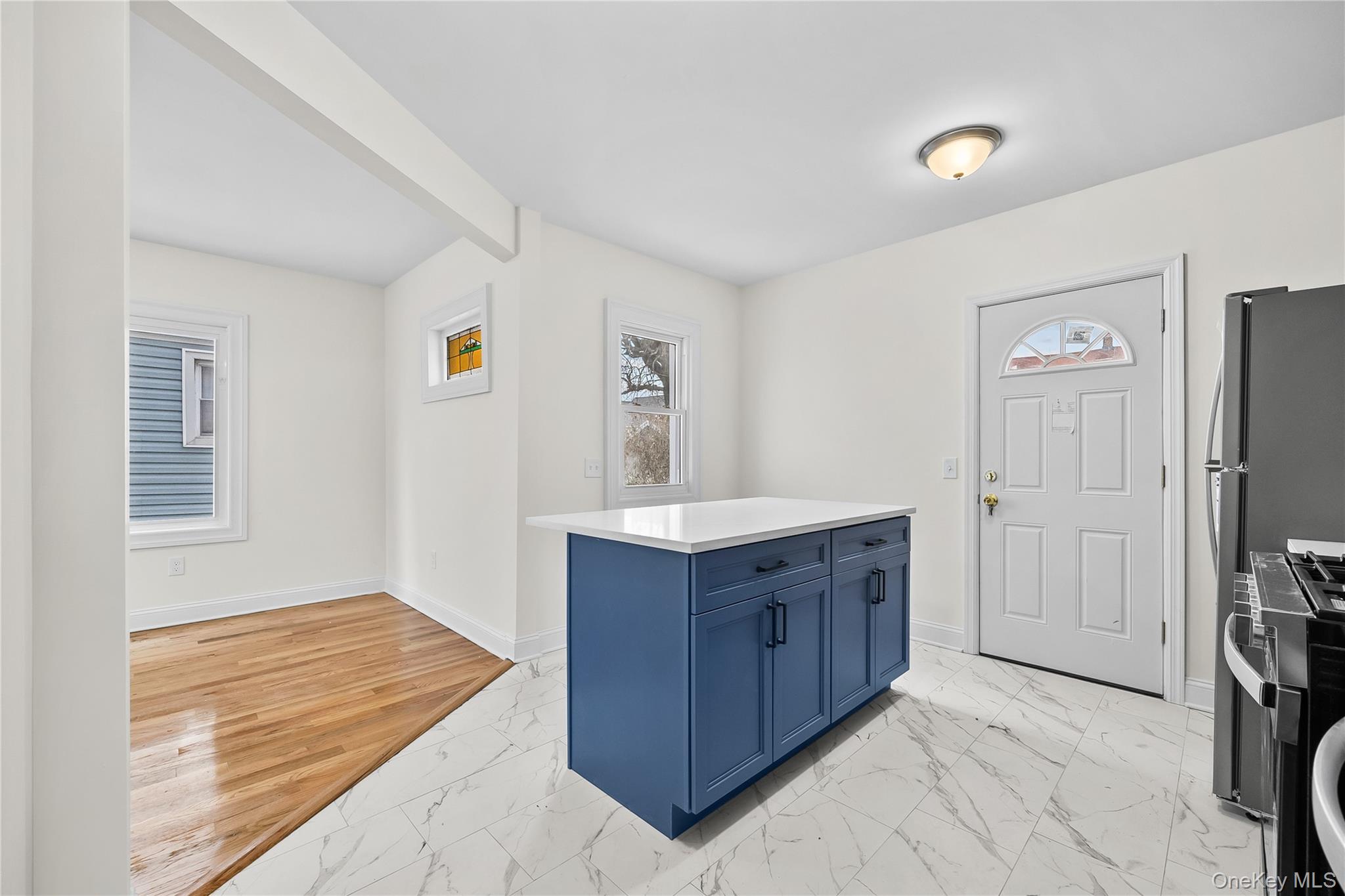115-12 197th Street Queens, NY 11412 - Photo 11 of 26 a room with a dresser and a window