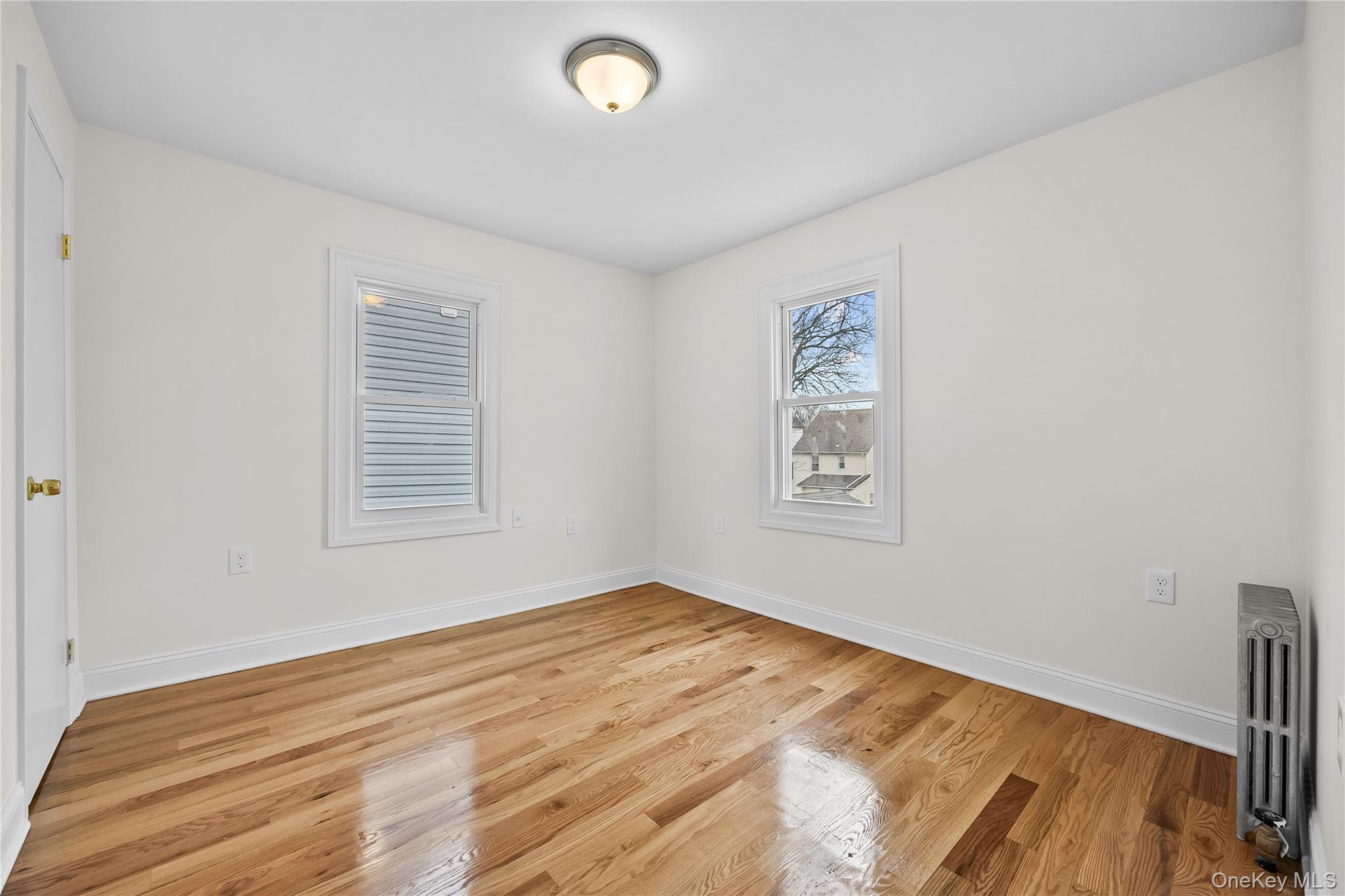 115-12 197th Street Queens, NY 11412 - Photo 18 of 26 an empty room with a window