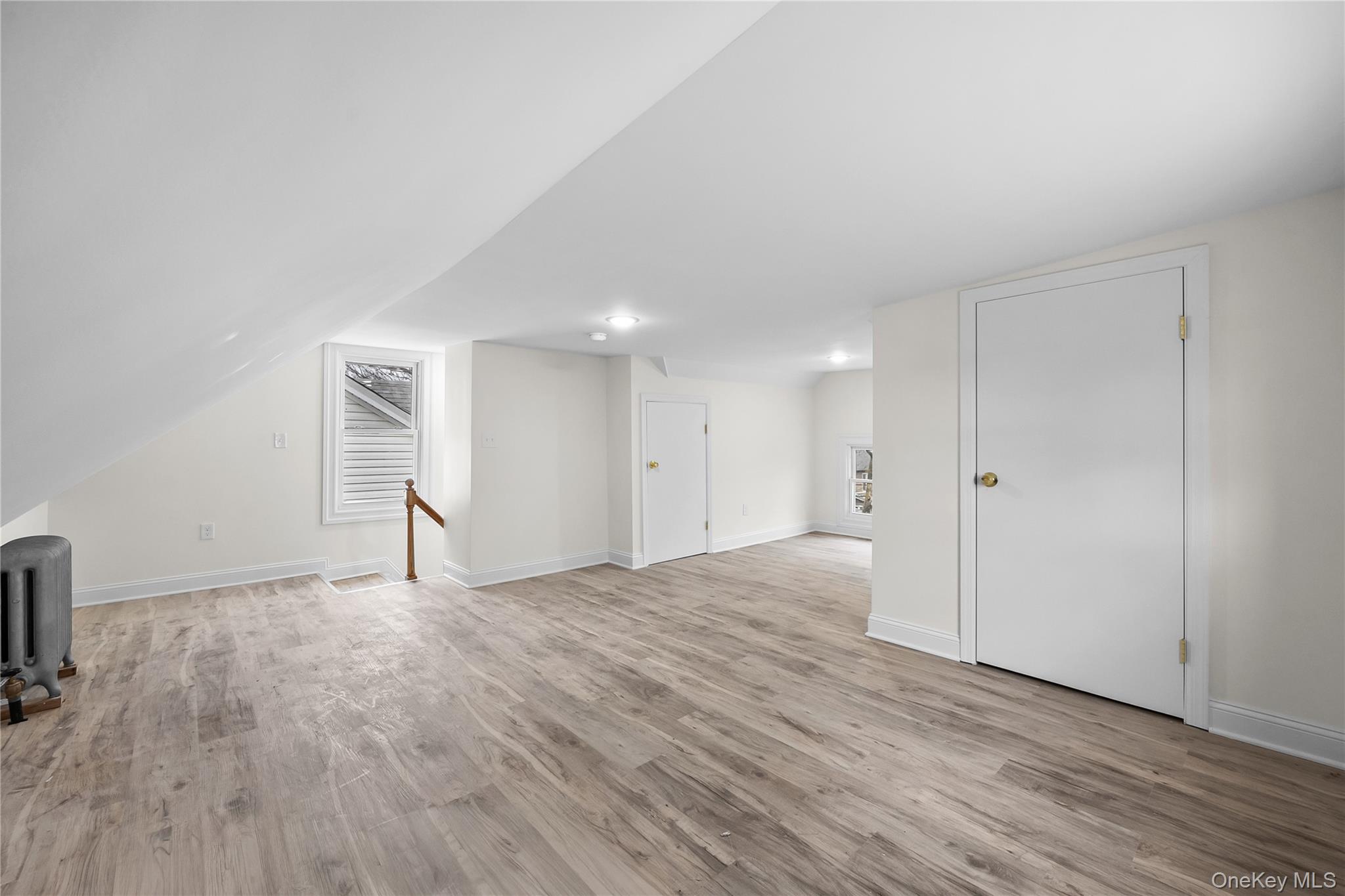 115-12 197th Street Queens, NY 11412 - Photo 20 of 26 a view of an empty room with wooden floor