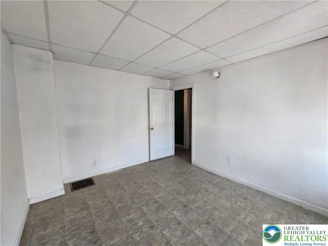 a view of a bathroom with a tub and shower