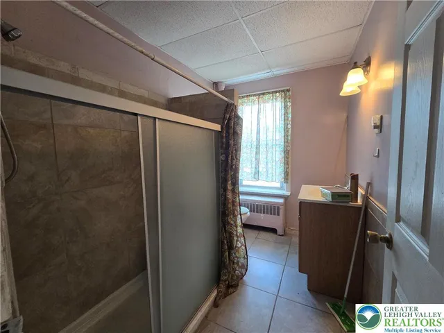 a view of room with window and wooden floor