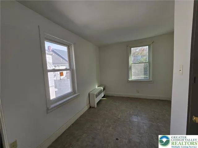 an empty room with windows