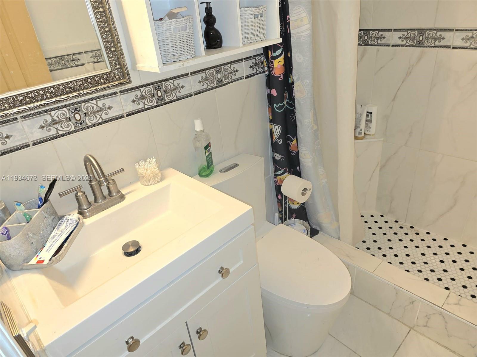 3601 Northwest 102nd Street Miami, FL 33147 - Photo 12 of 19 a bathroom with a sink toilet and shower