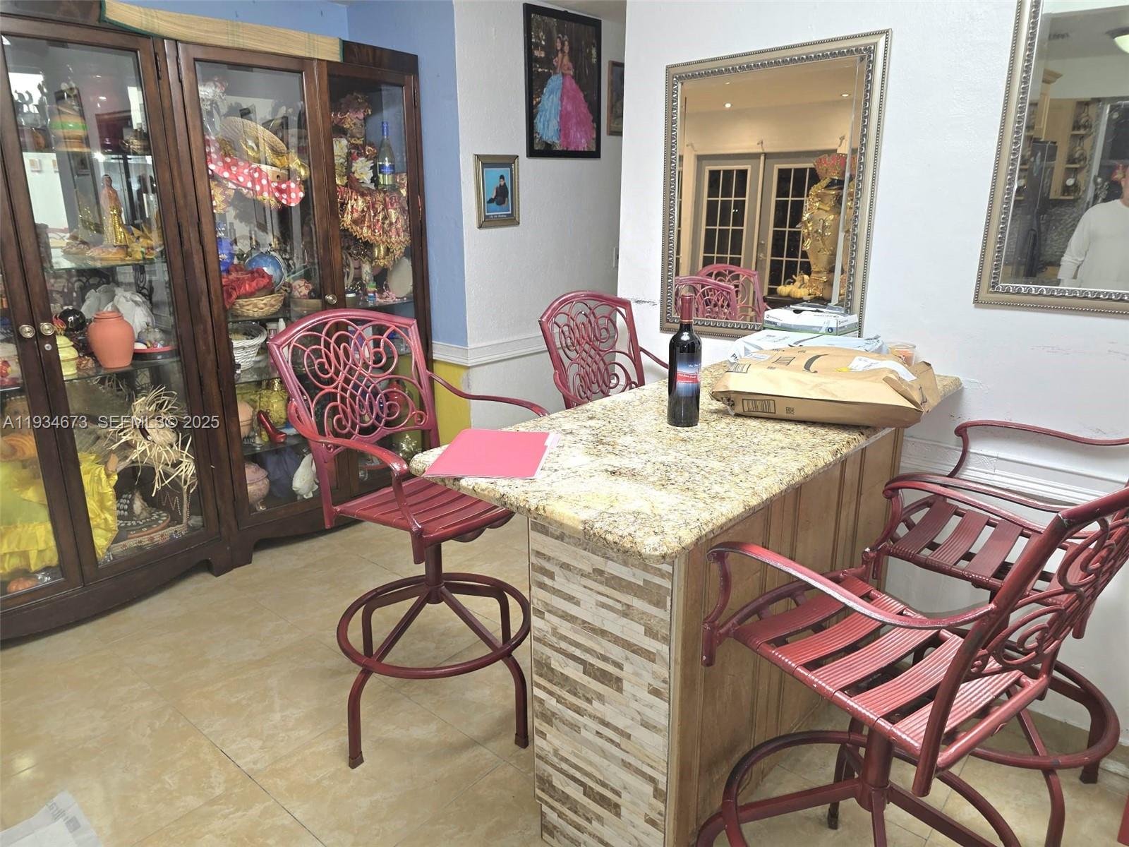 3601 Northwest 102nd Street Miami, FL 33147 - Photo 3 of 19 a view of a dining room with furniture and chandelier