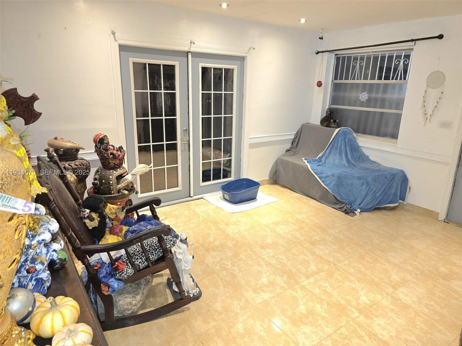 3601 Northwest 102nd Street Miami, FL 33147 - Photo 6 of 19 a bed sitting in a room next to a window