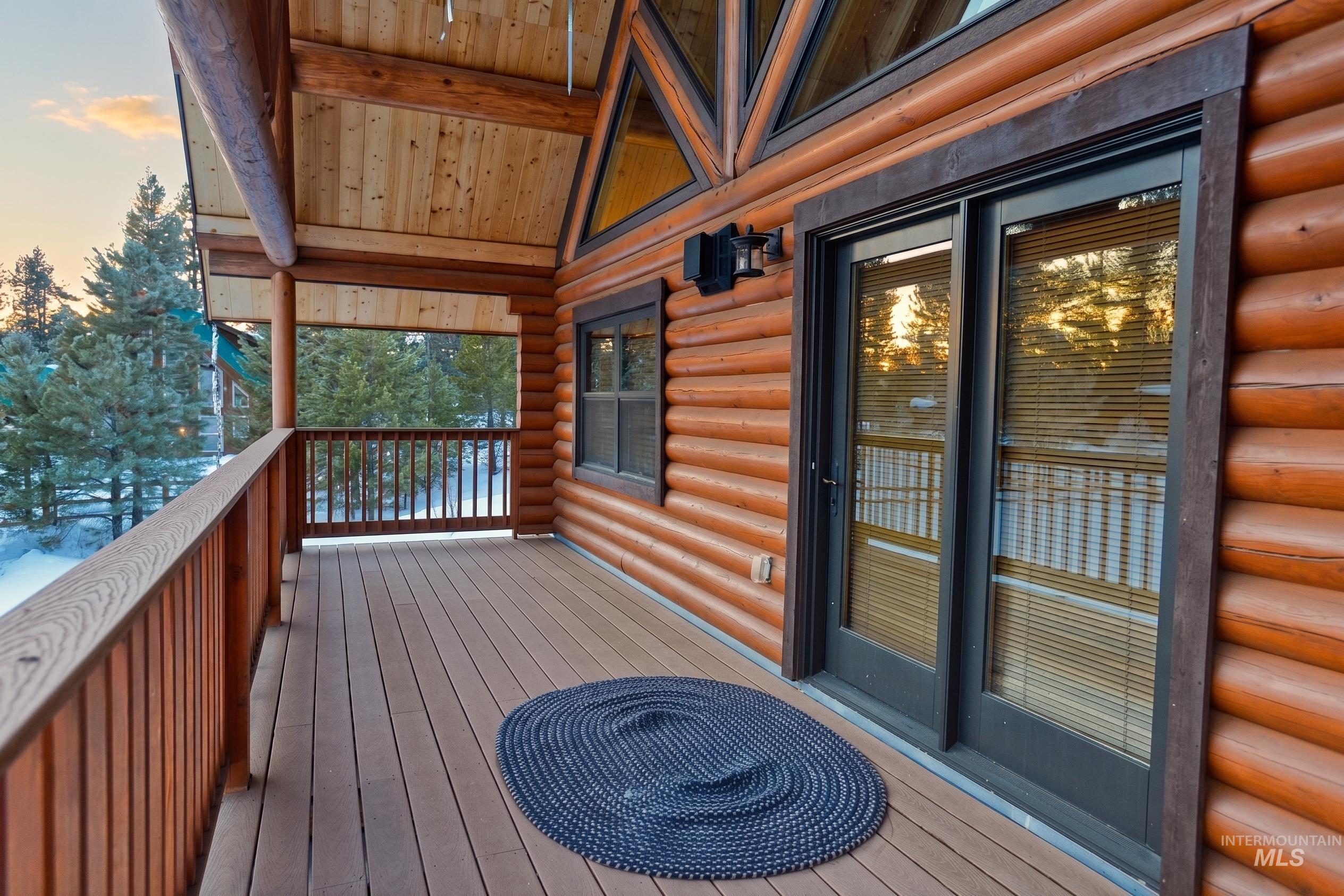 788 Chad Loop McCall, ID 83638 - Photo 13 of 22 Exterior deck featuring composite decking, wood railing, and exposed wood ceiling