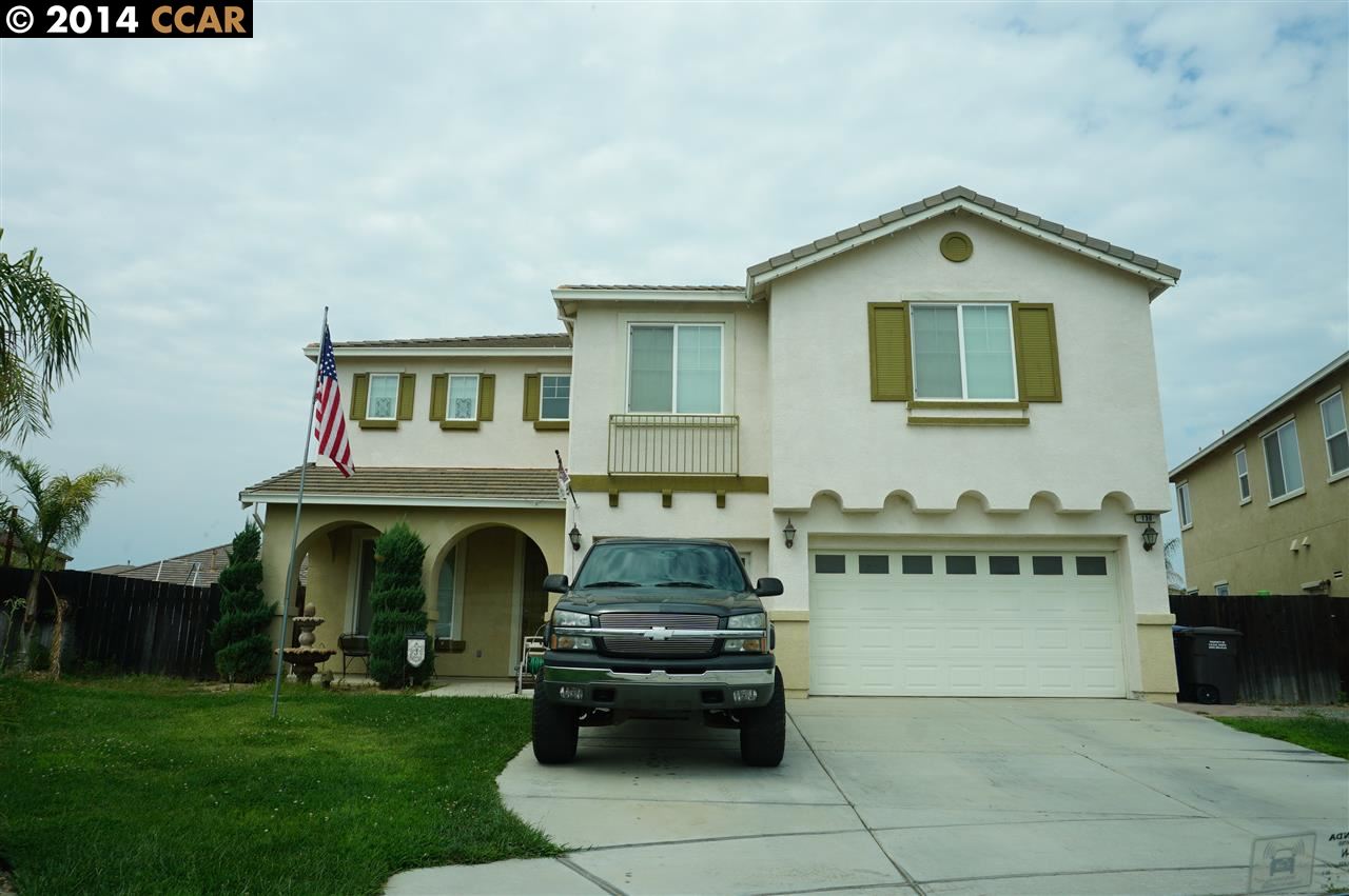 a view of a car parked in front of house