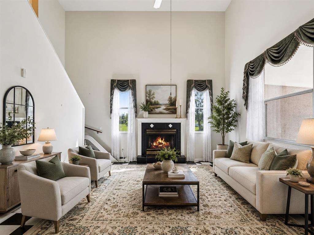 15420 Aubrey Avenue Spring Hill, FL 34610 - Photo 13 of 28 a living room with furniture and a fireplace