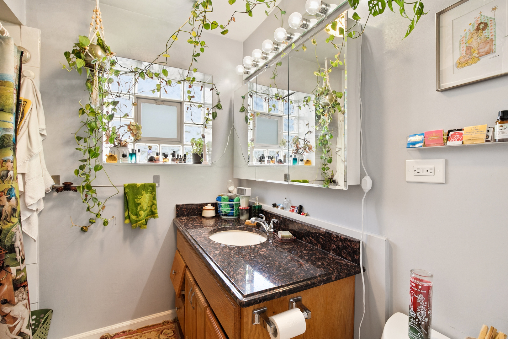 4006 West Nelson Street, Unit 6B Chicago, IL 60641 - Photo 12 of 13 a bathroom with a granite countertop sink a mirror and shower