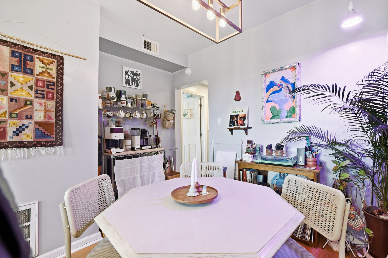 4006 West Nelson Street, Unit 6B Chicago, IL 60641 - Photo 3 of 13 a dining room with furniture and wooden floor