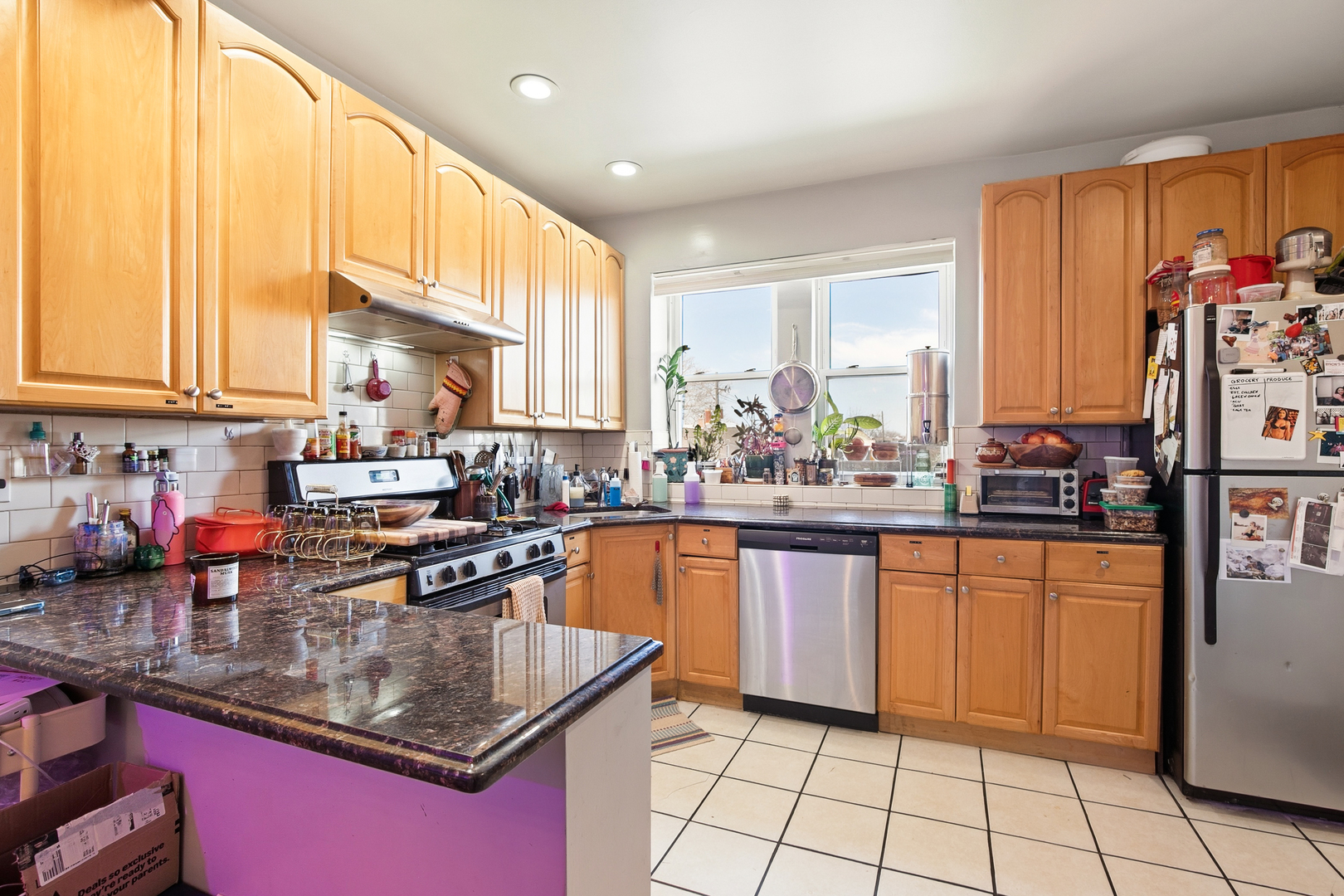 4006 West Nelson Street, Unit 6B Chicago, IL 60641 - Photo 4 of 13 a kitchen with stainless steel appliances granite countertop a stove sink and cabinets