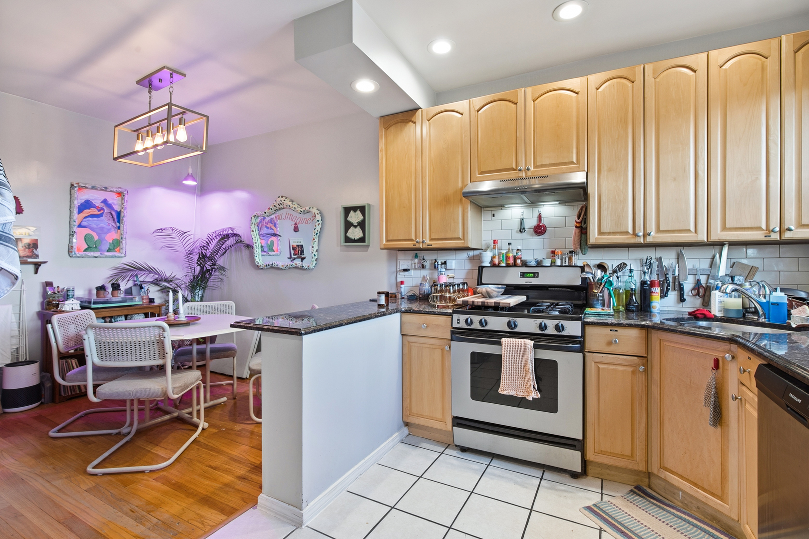 4006 West Nelson Street, Unit 6B Chicago, IL 60641 - Photo 6 of 13 a kitchen with a stove a refrigerator and cabinetry