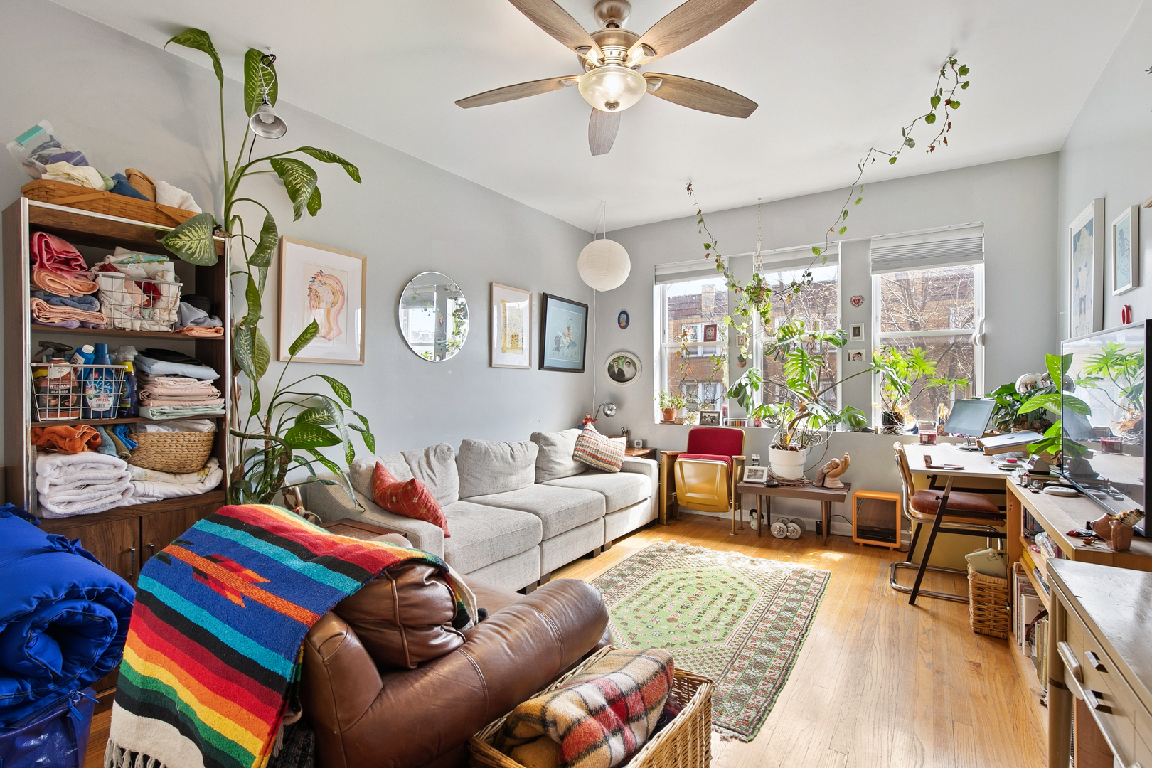 4006 West Nelson Street, Unit 6B Chicago, IL 60641 - Photo 7 of 13 a living room filled with furniture and a chandelier